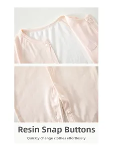 Detail of pink baby romper featuring resin snap buttons and breathable mesh cotton fabric