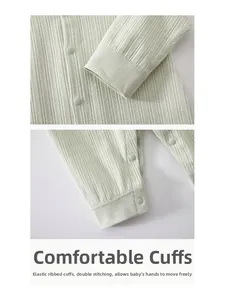 Close-up of elastic ribbed cuffs and durable snap buttons on baby cotton romper