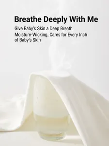 Breathable white cotton newborn jumpsuit showing steam penetration and fabric texture