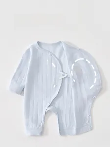 Detail showing the double-layer belly protection design on a blue cotton infant bodysuit