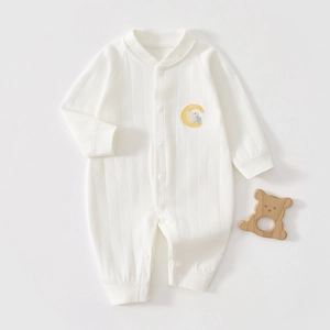 Detail shot of white long sleeve baby romper featuring cute rabbit and moon embroidery