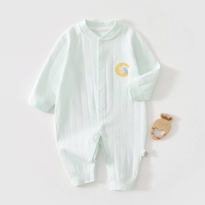 Detail view of light green ribbed baby romper with elephant embroidery and wooden teether