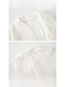 Detailed view of the soft knitted baby romper neck with durable hemmed round neckline
