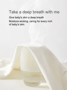 Breathable cotton newborn bodysuit showing steam passing through fabric for ventilation