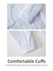 Detail of baby organic cotton romper featuring striped texture and durable stitching