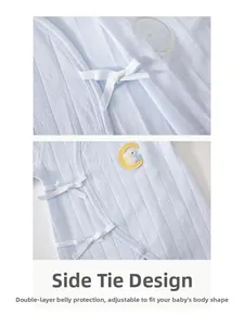 Detail of baby cotton romper featuring side ties and double-layer belly protection