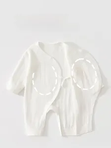 Detail of white newborn cotton bodysuit featuring double-layer belly protection design