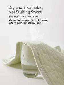 Breathable quilted cotton baby romper in light green featuring star and moon patterns