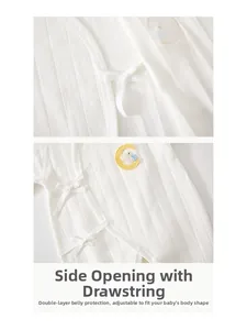 Detail of newborn ribbed cotton romper with side tie closure and moon bunny embroidery