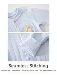 Detail of soft blue cotton baby romper featuring embroidered moon rabbit and flat seam craft