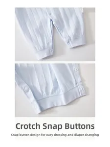 Detail of baby cotton romper showing the snap button closure for easy diaper changes