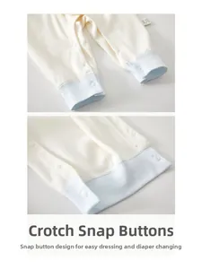 Detail of soft cotton baby romper showing bottom snap buttons for easy diaper changes