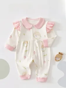 Detail of baby romper with pink Peter Pan collar and cute rabbit floral print