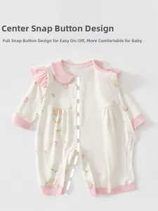 Close-up of baby romper featuring snap button design and cute bear floral print patterns