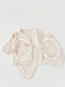 Detail of baby organic cotton bodysuit featuring double-layer tummy protection and cute prints