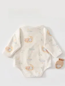 Detail view of baby long sleeve bodysuit with sleeping bear and moon cartoon pattern