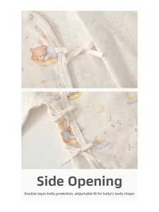 Detail of organic cotton baby bodysuit with side ties, double-layer belly protection and bear print