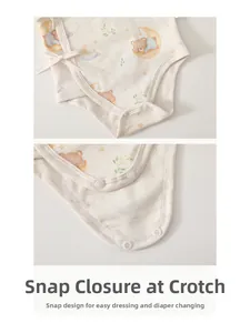 Detail of baby organic cotton bodysuit with bear prints and snap button closure