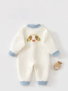 Detail view of baby quilted romper with cartoon dog print and blue ribbed trim details