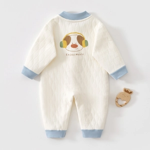 Detail of baby quilted romper featuring a cartoon dog print and blue ribbed sleeve cuffs