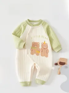 Detailed view of quilted cotton baby romper with Little Bear print and diagonal snaps