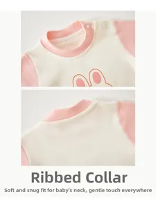 Detail of baby bodysuit neckline with shoulder snaps and cute rabbit ear print design