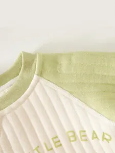 Thick padded baby ribbed knit romper in light green and cream with seamless sewing