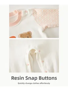 Close-up of baby romper showing durable resin snaps and soft geometric pattern fabric