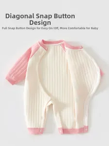 Detail of baby thermal romper with easy-to-use side snap buttons and soft ribbed texture