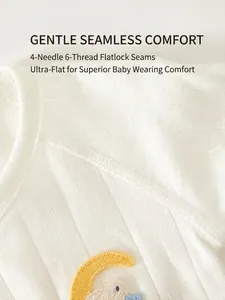 White cotton ribbed newborn kimono top featuring flatlock seams and yellow moon embroidery