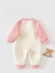 Detailed back view of pink and beige striped baby romper with soft ribbed cotton texture