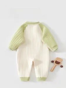 Close-up of baby romper with ribbed velvet texture and warm padded material