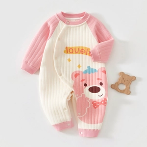 Detail of baby romper featuring soft ribbed fabric and snap buttons for easy dressing