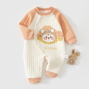 Detail view of thickened baby romper with cartoon lucky print and side snap buttons