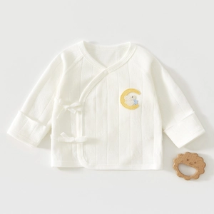 Detail of newborn baby kimono shirt in pure cotton with cute moon and rabbit embroidery