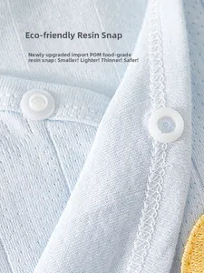 Close-up of baby garment featuring food-grade POM resin buttons and breathable cotton knit