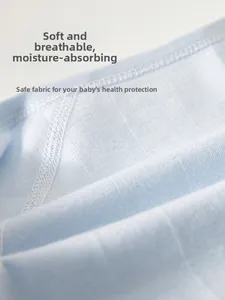 Macro detail of soft light blue cotton fabric showing breathable texture and fine stitching