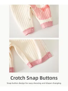 Detail view of snap button closure on quilted cotton baby romper for easy dressing