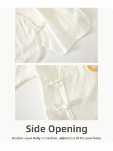 Detail of newborn cotton kimono top showing adjustable side ties and double-layered front