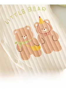 Detail of baby romper with little bear print and high-quality rib knit fabric texture