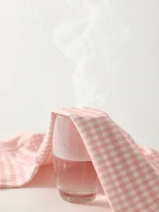 Pink and white checkered infant knit romper with breathable and sweat-wicking fabric