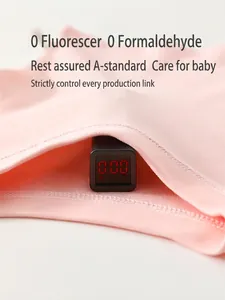 Pink cotton baby romper set being tested for zero formaldehyde and no fluorescent agents