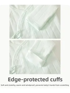 Detail of baby cotton top featuring breathable ribbed fabric and protective fold-over mittens