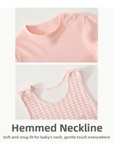 Detail of baby bodysuit neckline with shoulder snaps and pink checkered knit fabric