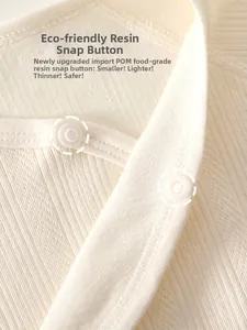 Detail of baby bodysuit showing food-grade POM resin snaps on soft cotton ribbed fabric