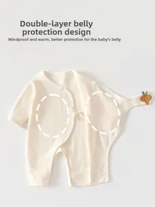 Detail of newborn baby romper with double-layer tummy protection and strawberry patch