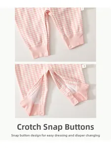 Close-up of bottom snap fasteners on pink checkered baby romper for easy diaper changes