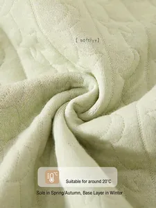 Quilted light green baby romper made of triple-layer thermal cotton fabric for warmth