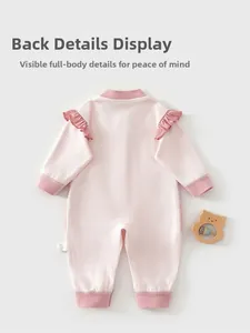 Detailed back view of baby girl long sleeve romper with pink ruffles and soft cotton fabric