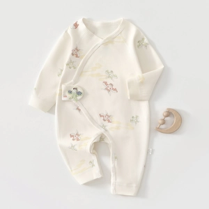 Detail of newborn organic cotton romper with butterfly prints and side snap closure